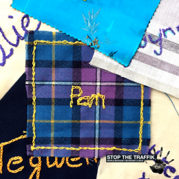 a-square-of-fabric-with-the-name-pam-stitched-in-the-middle